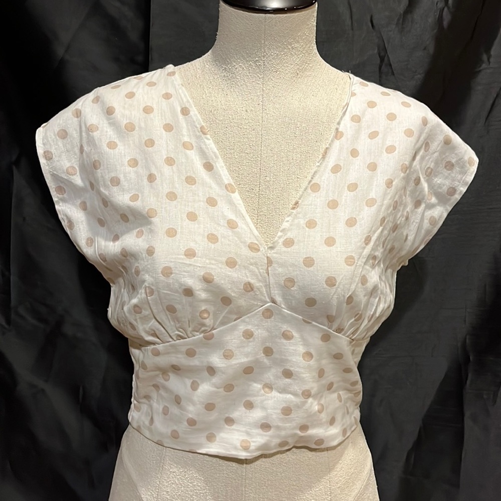 White top with tan polkadots